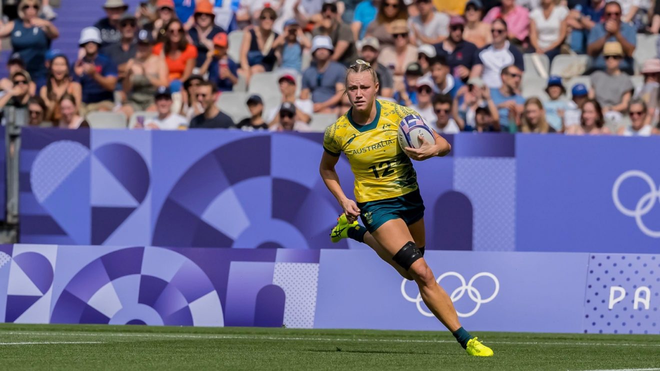 Australia's Maddison Levi runs in a try.