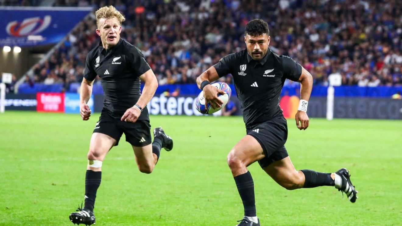 Richie Mo'unga and Damian McKenzie in action for the All Blacks in 2023.