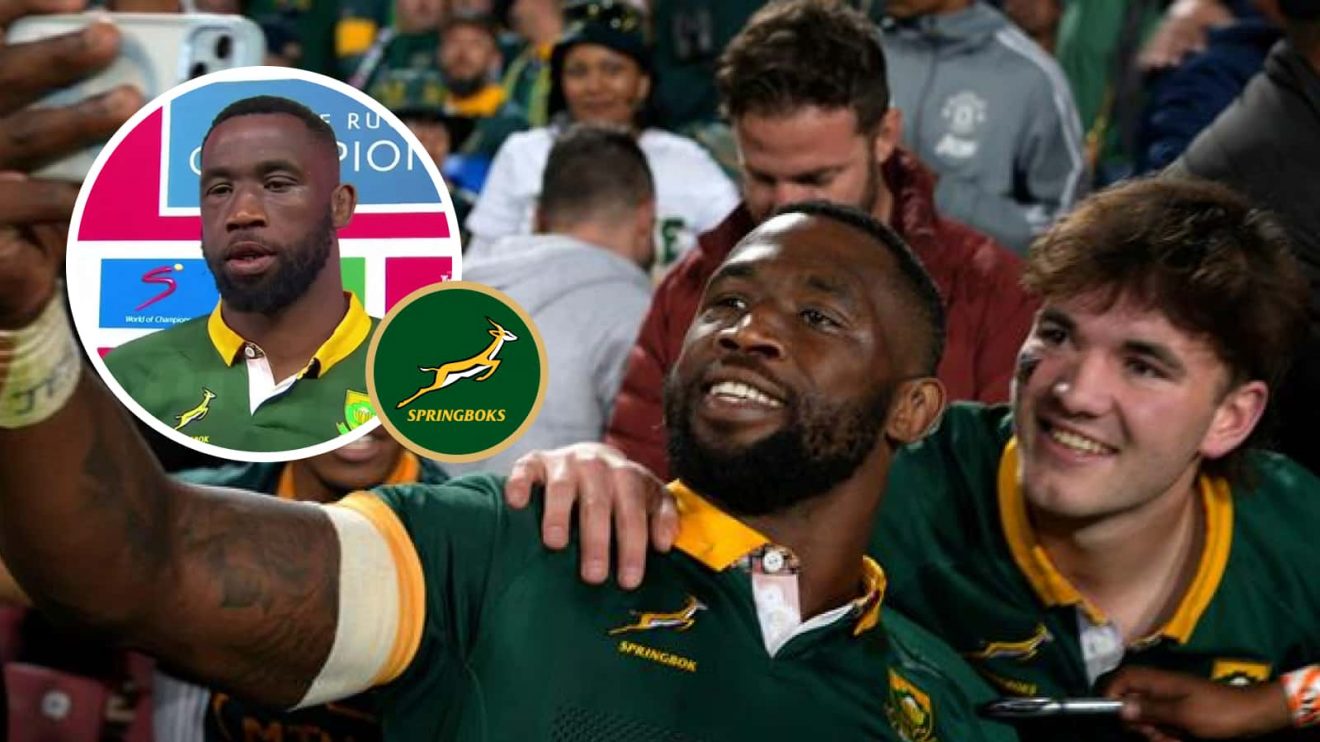 Springboks captain Siya Kolisi with a fan after the win over the All Blacks at Ellis Park.