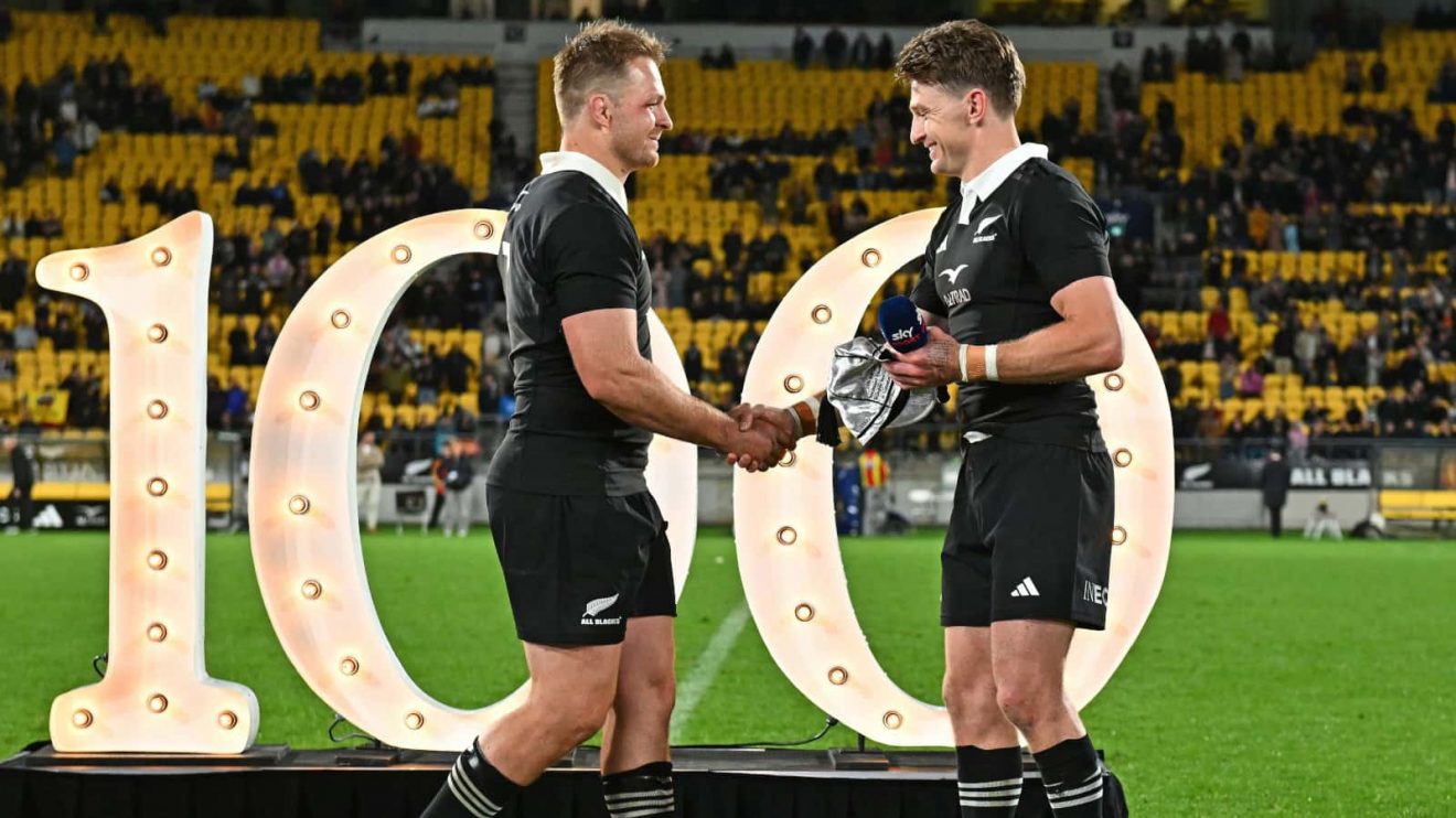 Beauden Barrett presenting Sam Cane with his 100th All Blacks cap.
