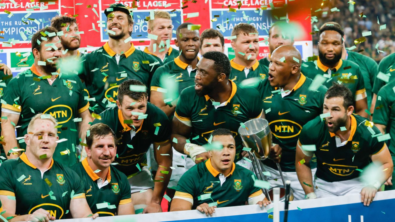 Springboks celebrate with Rugby Championship trophy.