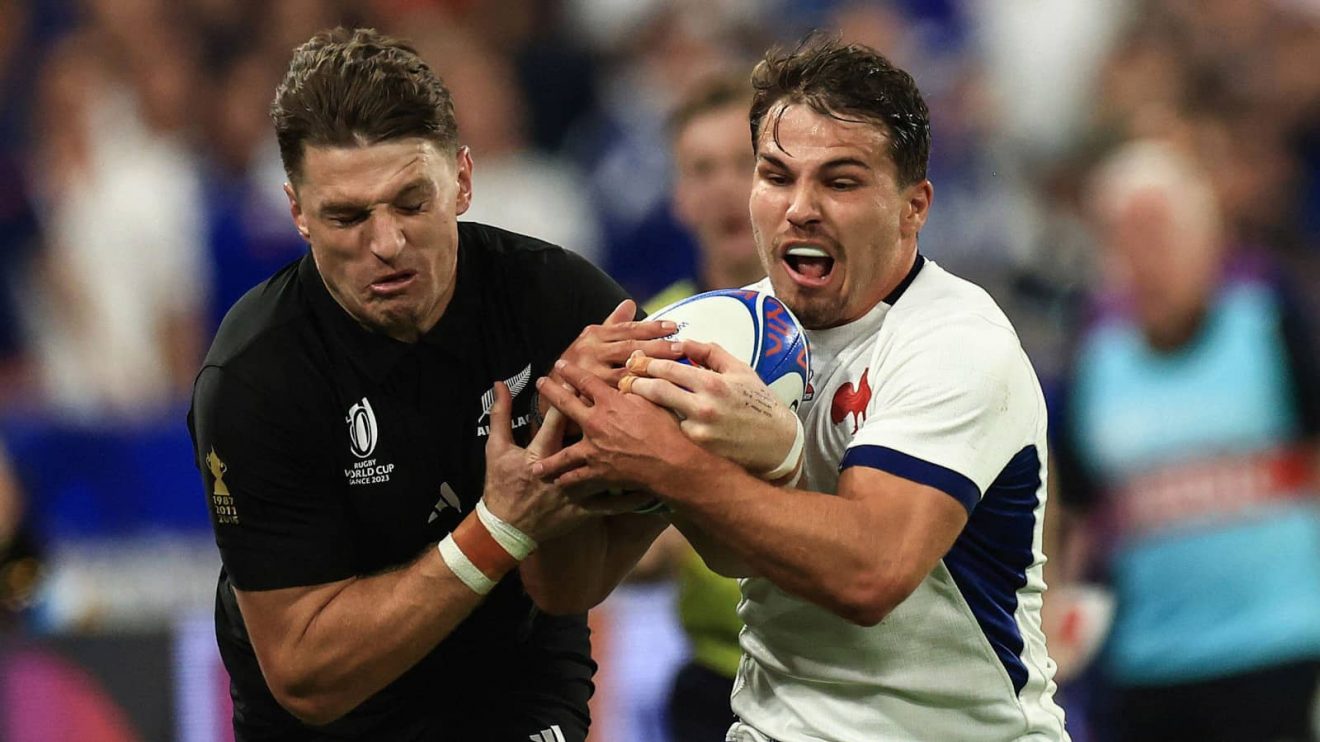 France's Antoine Dupont competing for the ball with All Blacks' Beauden Barrett at the 2023 Rugby World Cup.