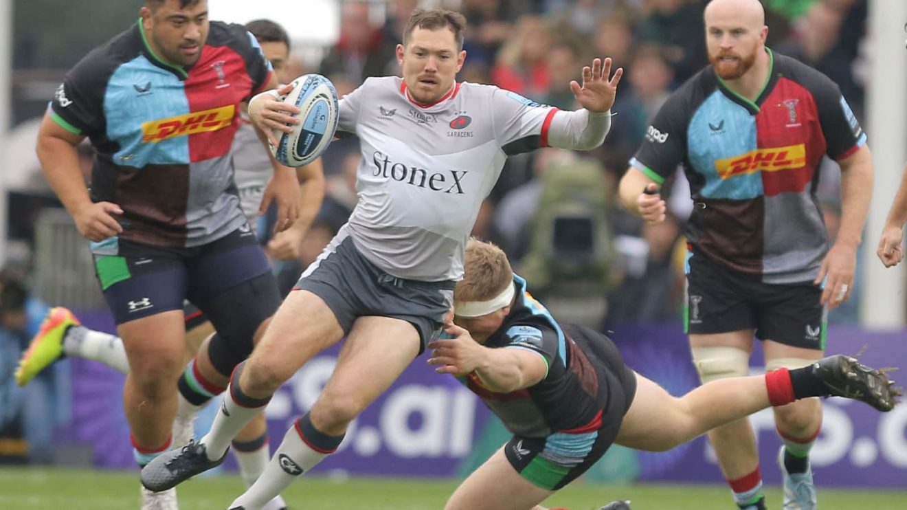 Harlequins' Fin Baxter tackling Saracens' Alex Goode during impressive display in the Premiership.