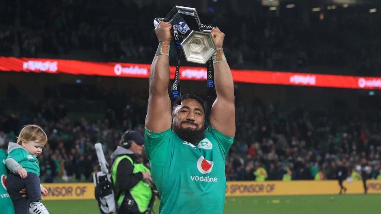 Ireland star Bundee Aki lifting the Six Nations trophy in 2024.