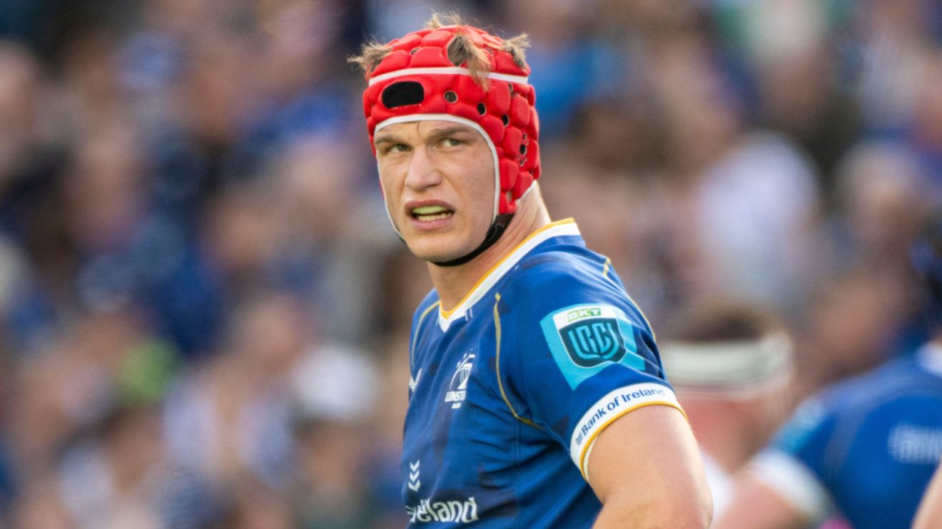 Leinster flanker Josh van der Flier looking on.