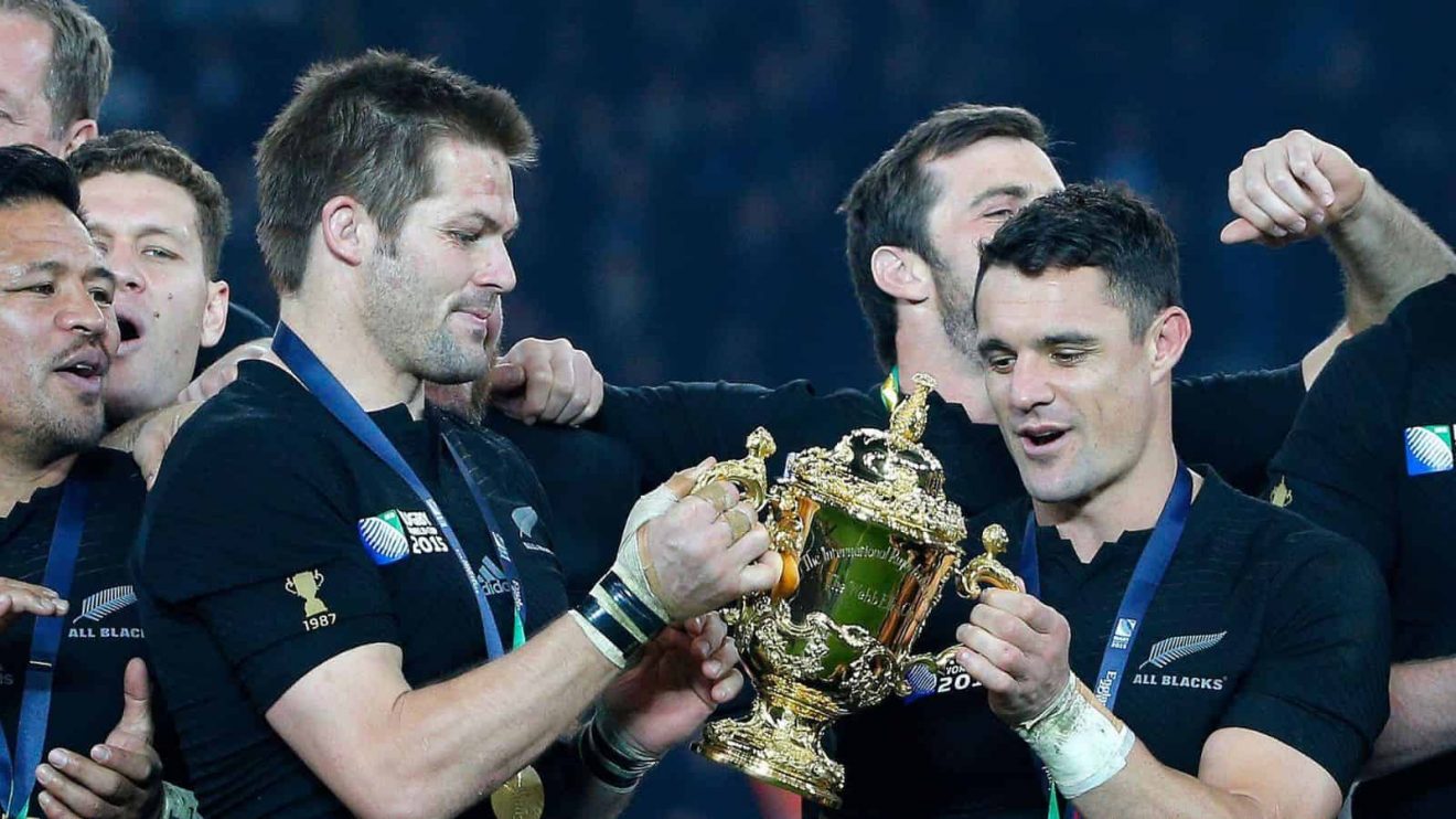 New Zealand's captain Richie McCaw and Dan Carter hold the trophy aloft after the Rugby World Cup final between All Blacks and Australia at Twickenham Stadium in London.