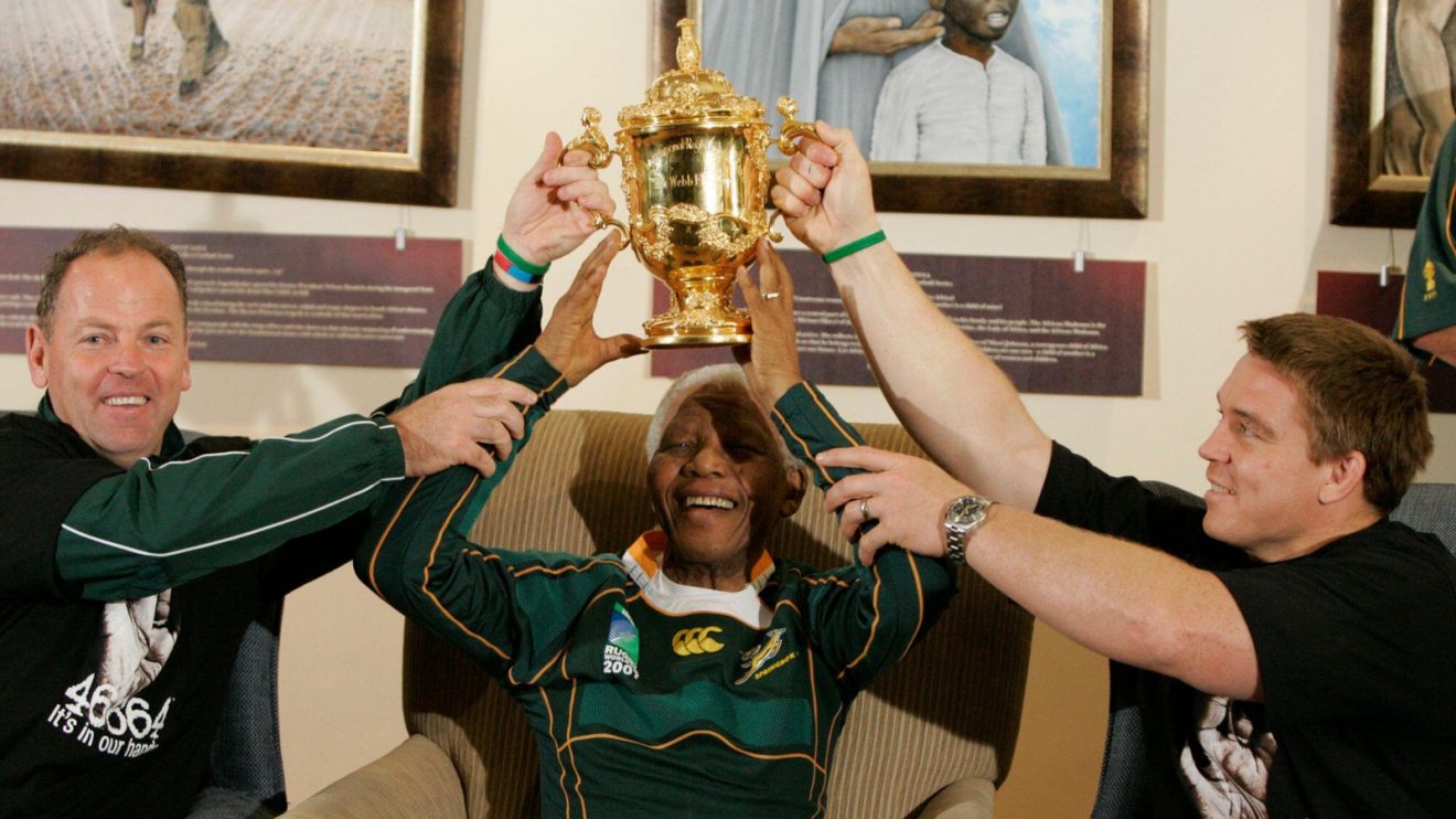 Ex-Springboks John Smit and Jake White with former President Nelson Mandela.