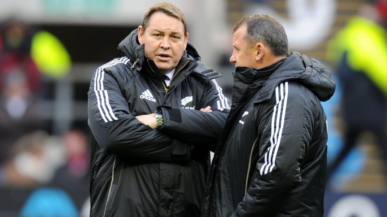 Coaches Steve Hansen and Ian Foster look on.
