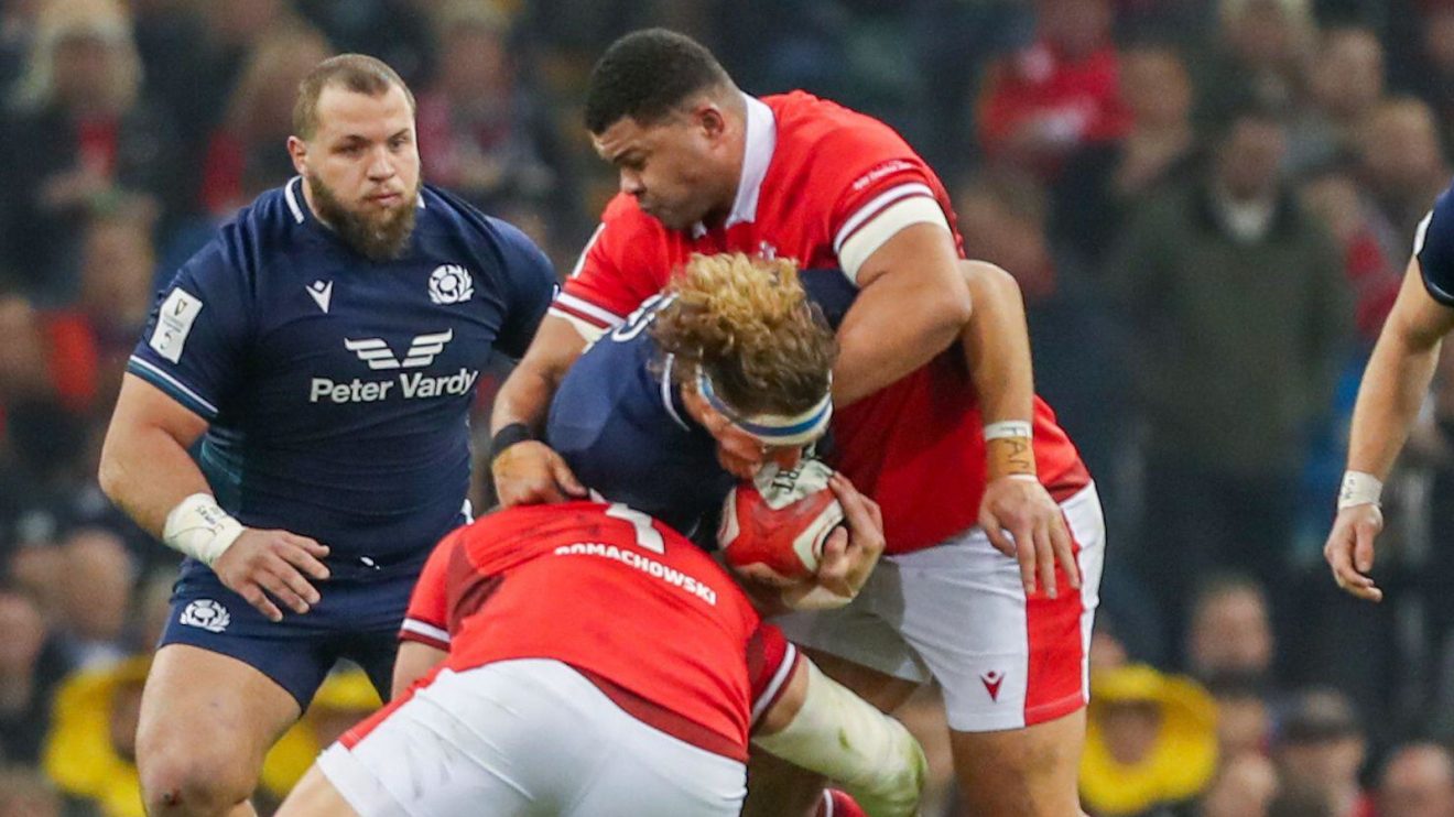 Wales prop Leon Brown making a tackle against Scotland.