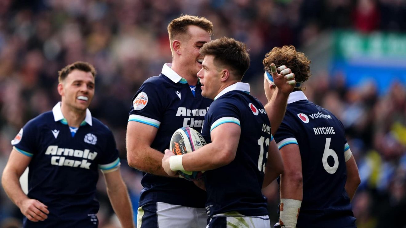 Scotland's Huw Jones (13) celebrates scoring the second try during the Guinness Six Nations match at Murrayfield Stadium