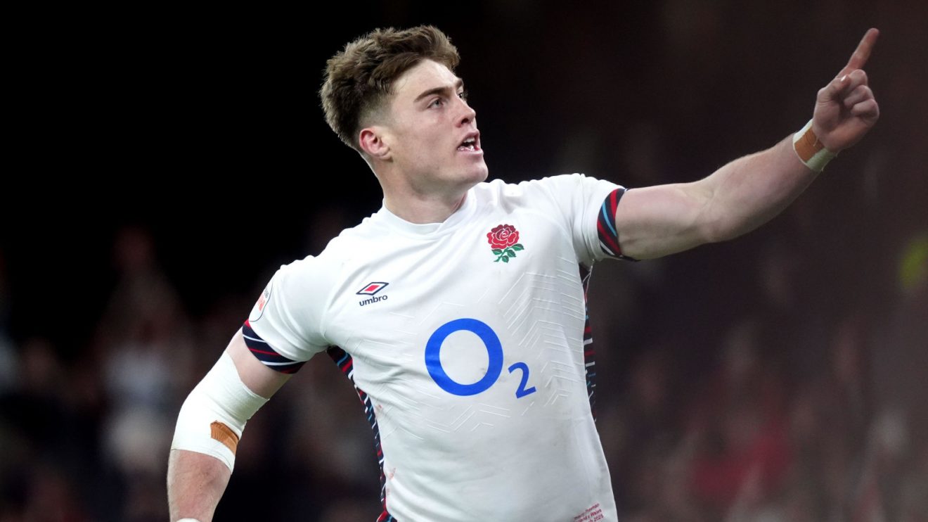 England centre Tommy Freeman celebrates try.