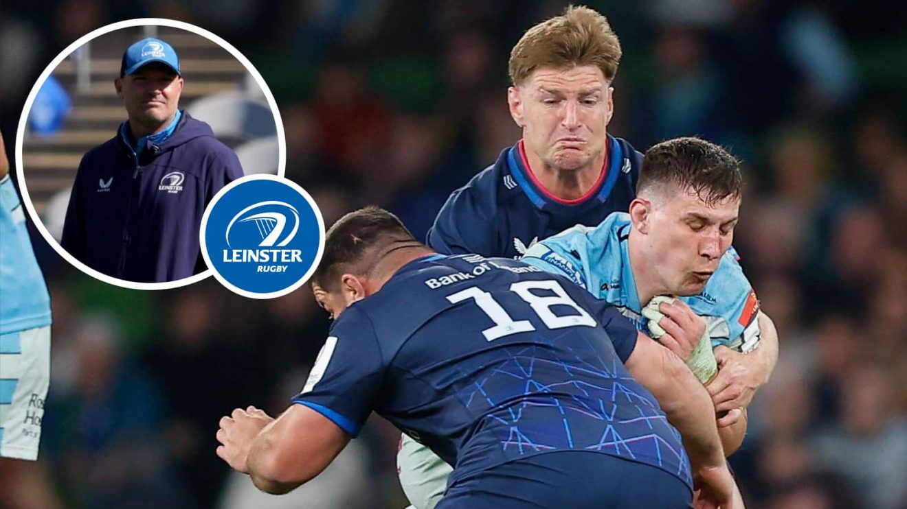 Rory Darge of Glasgow is tackled by Rabah Slimani and Jordie Barrett and an insert of Leinster coach Jacques Nienaber.