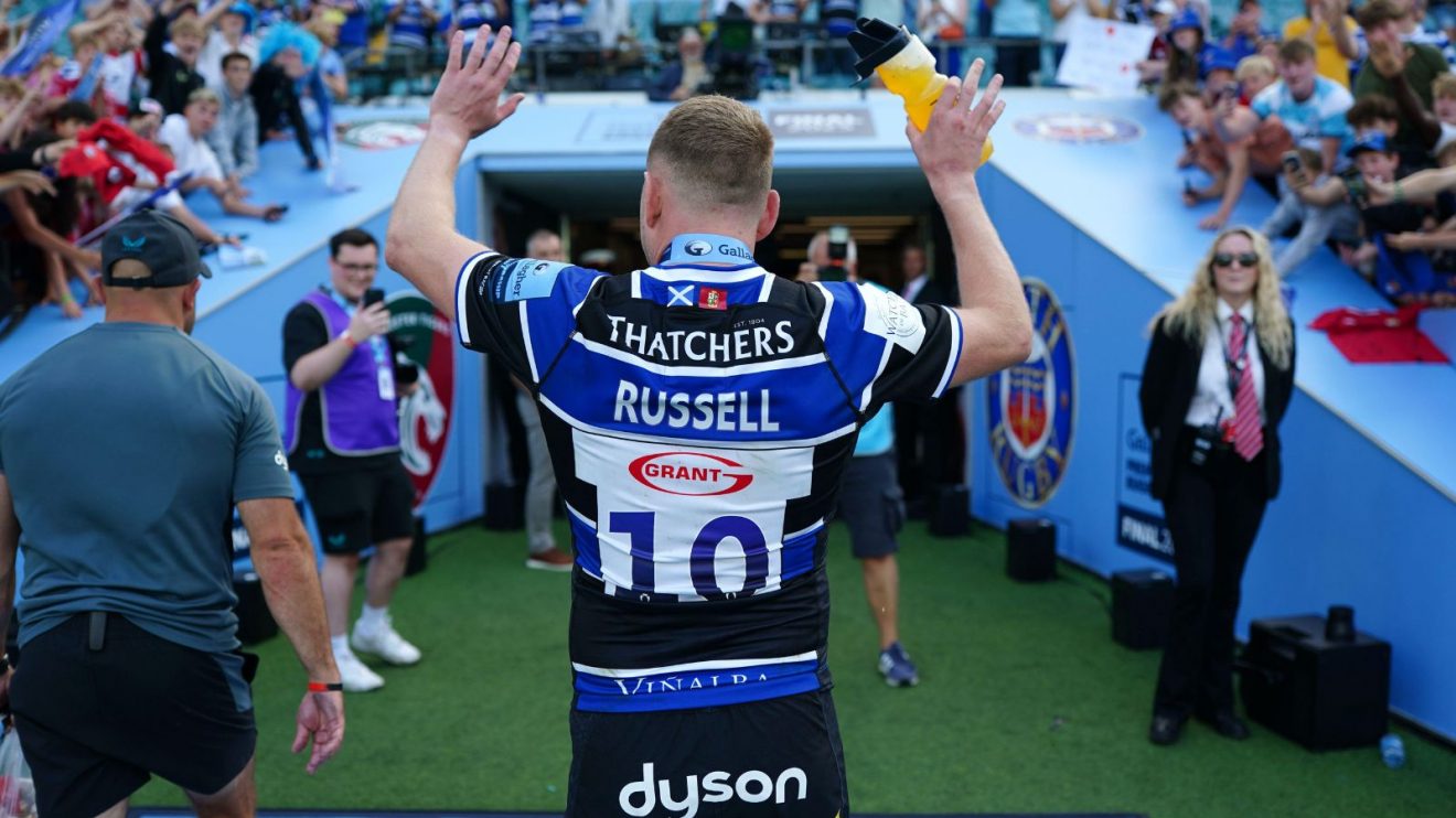 Finn Russell applauding fans after Bath's Premiership final win