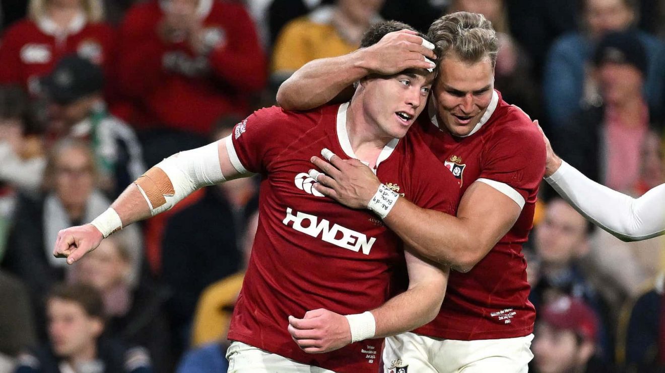 Tommy Freeman and Duhan van der Merwe celebrate B&I Lions try v Reds 2025.