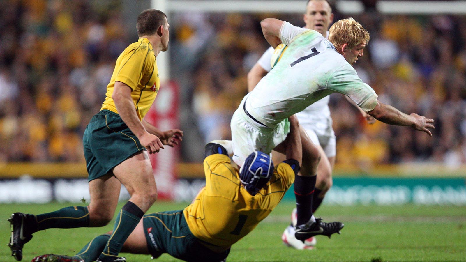 England captain Lewis Moody is tackled by Ben Daley of Australia 