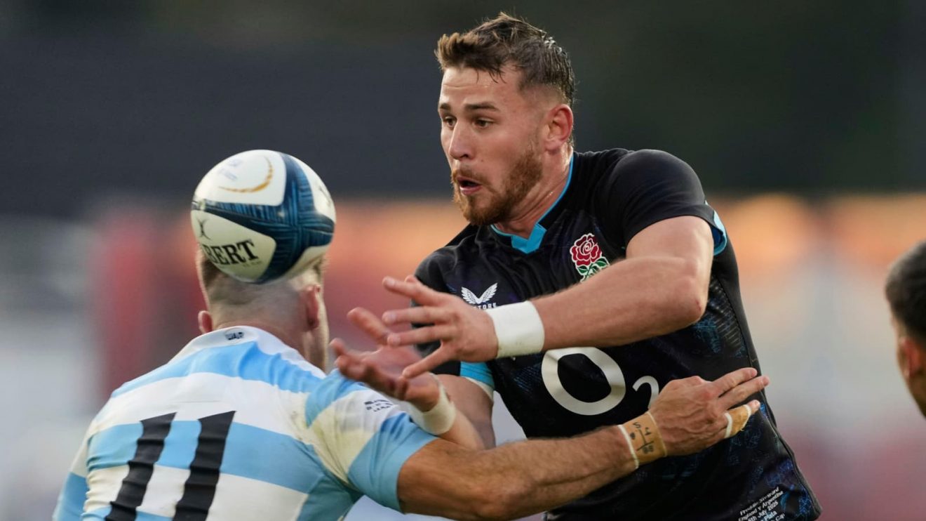 England's Freddie Steward, center, is tackled by Argentina's Santiago Cordero