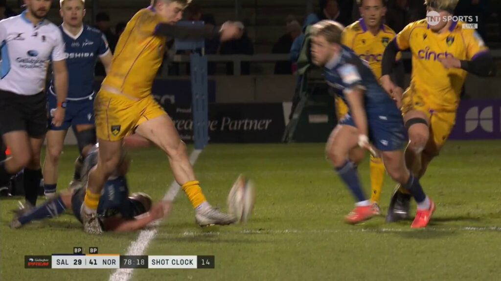 Tommy Freeman kicks the ball while out of the field of play.