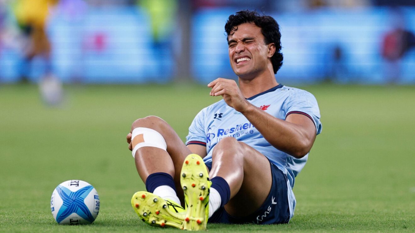 Joseph-Aukuso Suaalii wincing in pain after suffering a hamstring injury