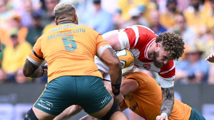 Japan Captain Warner Dearns is tackled during the Rugby test match between the Australian Wallabies and Japan at Queensland Country Bank Stadium in Townsville